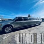 Front side view of the 14-passenger stretch SUV limo in Norfolk with polished silver finish.