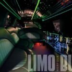 Luxurious black leather interior with green LED ceiling lights inside Norfolk’s 14-passenger SUV limo.