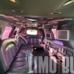 Premium black leather interior of a 14-passenger white SUV limousine in Norfolk.