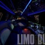 Black SUV limousine interior featuring blue and green fiber optic lighting at Norfolk Limo Bus.