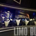 Luxury party cup holders with black and white napkins inside the Norfolk SUV limo.