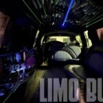 Spacious rear seating and illuminated bar in Norfolk’s 14-passenger black SUV limousine.