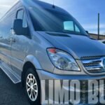 Front angle view of our Mercedes Sprinter 15-passenger party bus, offering stylish group transportation in Brantford.