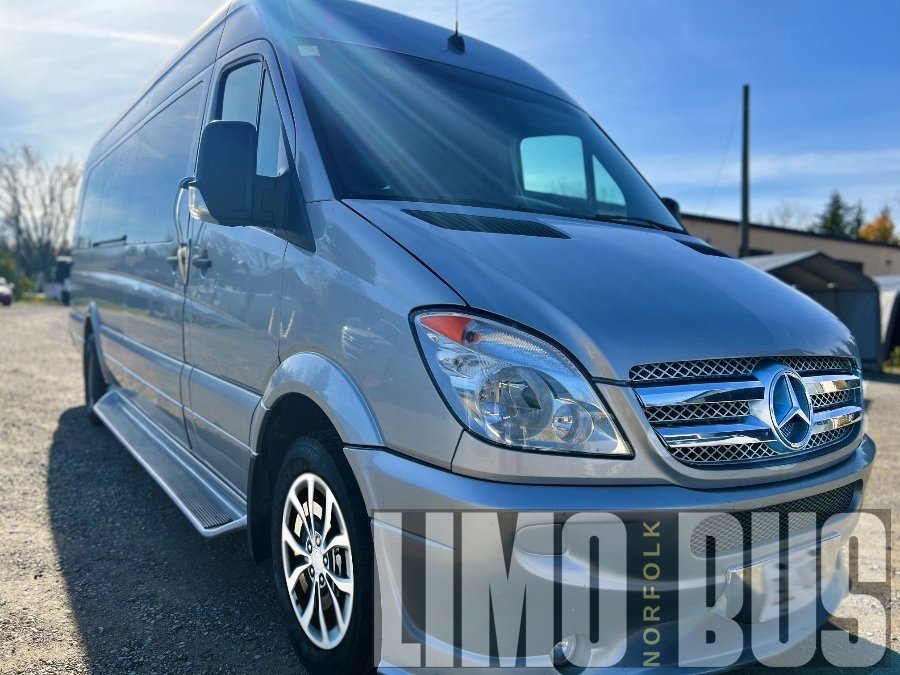 Silver Mercedes 15-passenger party bus exterior, offering premium transportation services for events, weddings, and parties in Norfolk.