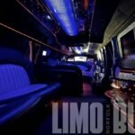Full view of luxury seats, LED lighting, and entertainment features inside the Norfolk SUV limo.
