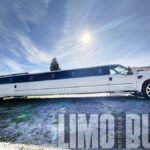 Full daytime view of the white stretch SUV limousine in Norfolk.