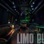 Luxury interior of the 25-passenger party bus featuring green LED ceiling lights and built-in bar stations.