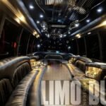Spacious black leather seating and open layout inside the 30-passenger party bus, perfect for weddings, proms, and corporate events.